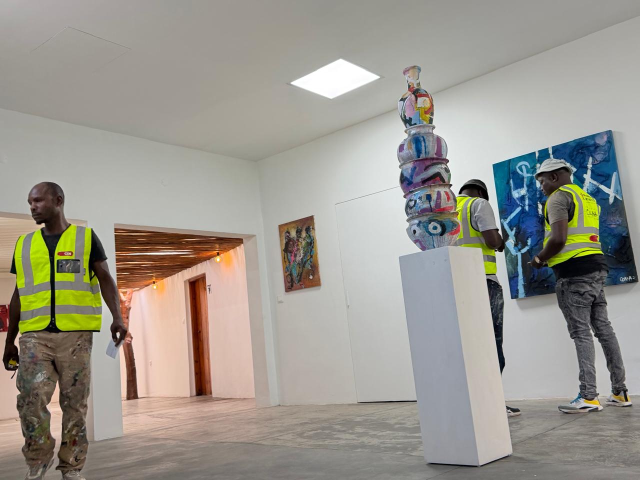 Ceramic totem and paintings installed in the gallery